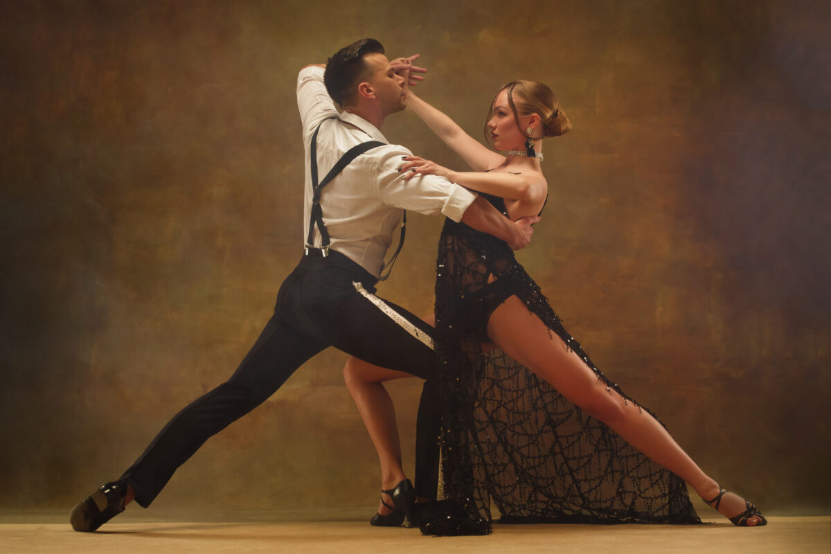 flexible young modern couple dancing tango studio fashion portrait attractive dancing couple man woman passion love perfect skin facial make up human emotions love passion